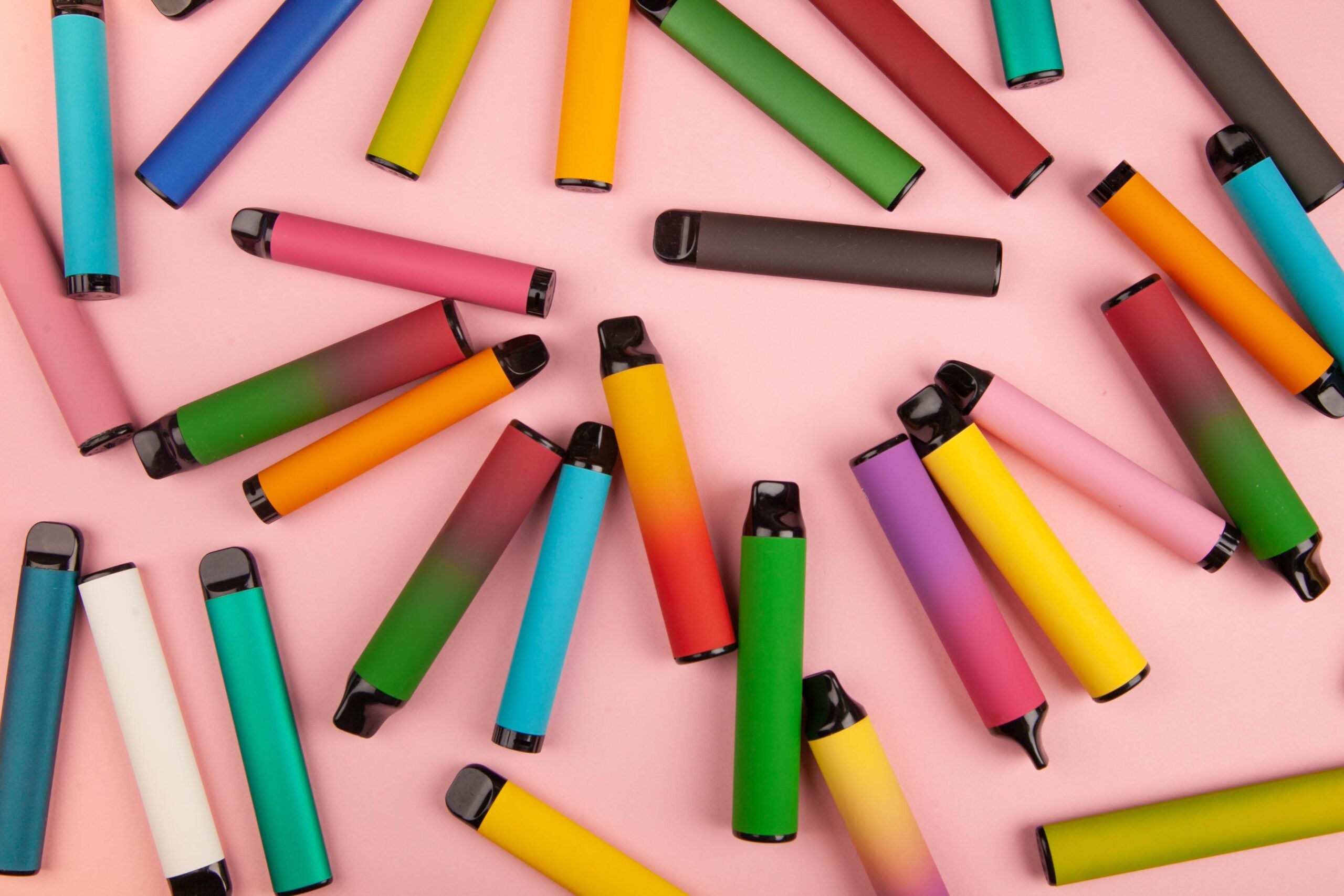 Disposable,E-cigarettes,With,Different,Flavors,In,Pink.,The,Concept,Of