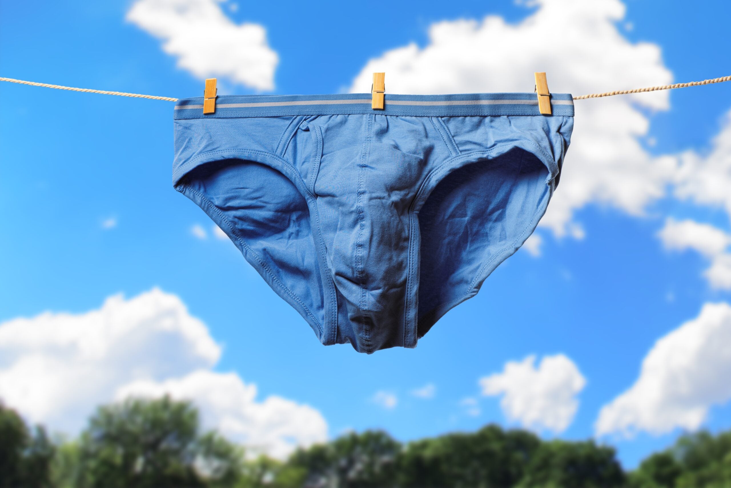 Clean,Blue,Men’s,Briefs,Hanging,On,Rope,To,Dry,Outdoors